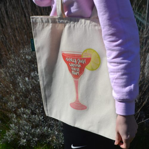 A natural coloured Organic tote with long handles, with a strawberry daiquiri design in the centre, which has the phrase "Girls just wanna have rum" on the glass. Size - 380 x 420mm, £12.50 including P+P. The cocktail is a vibrant red, with a lime on the side of the glass and the glass has a pink outline.