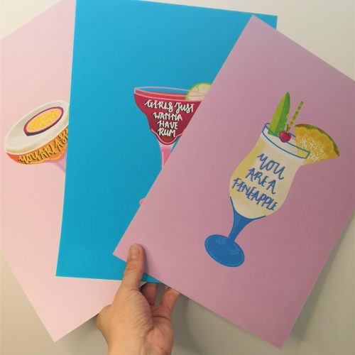 Three of ALBoH's cocktail prints. One being the Pornstar Martini Print, the second a Strawberry Daiquiri Print, and the last one is the Pina Colada Print
