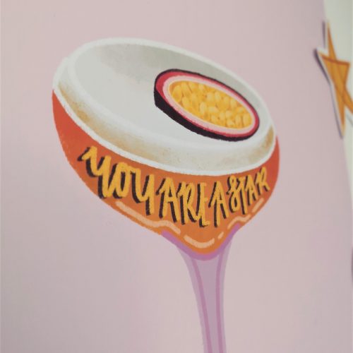 A pink wall art print with a pornstar martini in the centre, which has the phrase "You are a star" on the glass. Available in A5, A4 or A3 - pictured is the A4 size. The martini is a vibrant orange, with a white foam and passionfruit on top, the glass is a slightly deeper lilac/pink than the background. The print is printed onto 230gsm matte photo paper, with Recycled Cardboard + Compostable See-through bags to keep them safe in the post.