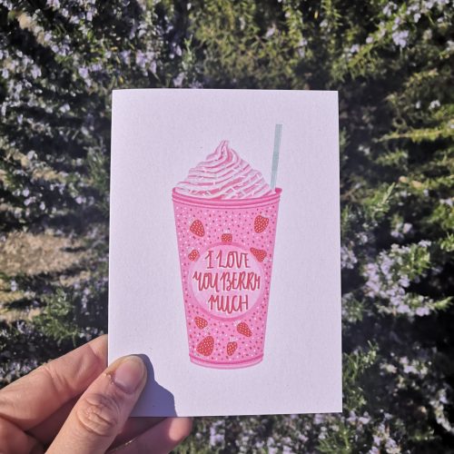 A white card with a bright pink strawberry milkshake in a plastic cup with a mint coloured straw, which has the phrase "I love you berry much" on the front. There are little red, white and pink spots and strawberries on the milkshake, and there's also whipped cream on too. On the back you'll find the A Little Bit of Hope logo, and a recipe for the BEST burger sauce. The card is printed onto Recycled Paper, with Recycled Envelopes + Compostable See-through bags to keep them safe.