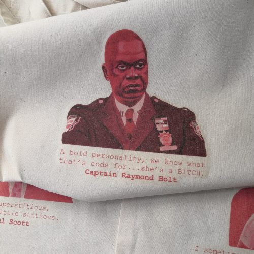 A natural coloured Organic tote with long handles, featuring Captain Raymond Holt from Brooklyn Nine Nine looking stern whilst wearing his police uniform. The quote reads "A bold personality, we know what that's code for...she's a BITCH", and is in a typewriter style font. The portrait is pink and red. Size - 380 x 420mm, £12.50 including P+P.