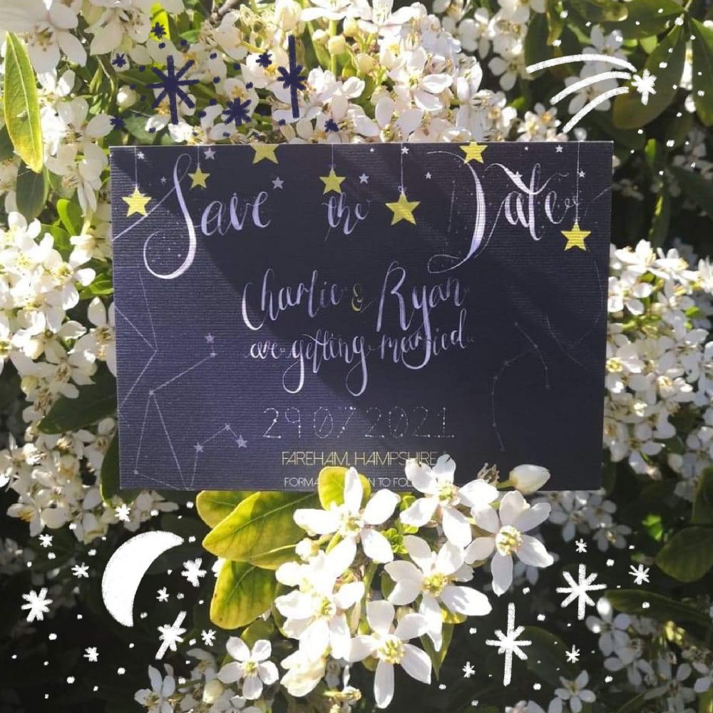 Starry Night stationery propped up on a flowery white shrub